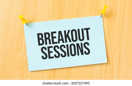 Breakout Sessions Sign Written On Sticky Note Pinned On Wooden Wall