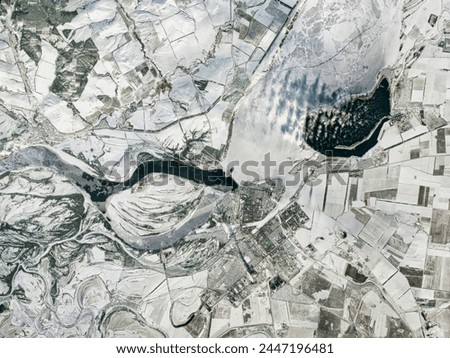 Breaks in Ice on the Volga River. This image of the Balakovo Nuclear Power Station and the Saratov Hydroelectric Power Station was captured. Elements of this image furnished by NASA.