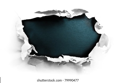 Breakthrough paper hole with black textured background.