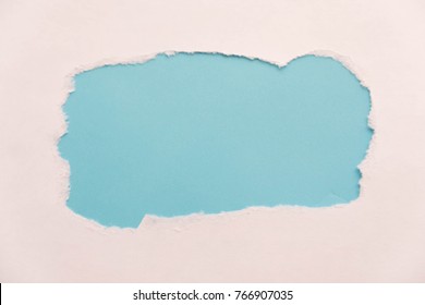 Breakthrough Paper Hole With Blue Background, Isolated On White.