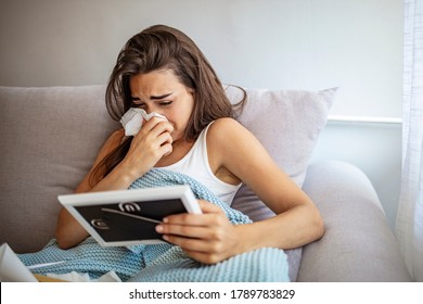 Break-up. Depressed young women holding a photo frame and crying. Longing woman with handkerchief looking at frame. Sad Depressed Girl Crying After Break-up Holding Framed Picture.