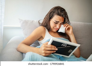 Break-up. Depressed Young Women Holding A Photo Frame And Crying. Longing Woman With Handkerchief Looking At Frame. Sad Depressed Girl Crying After Break-up Holding Framed Picture.