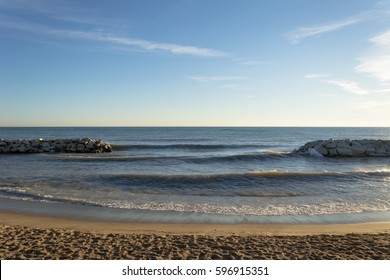 A Breakwall Frames The Horizon At The Rosewood Beach In Highland Park, IL.