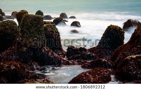 The breakwater changes shape due to the erosion of the waves