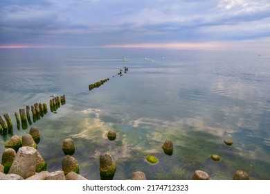 Breakwater On The Baltic Sea, Storm Clouds And Sunset