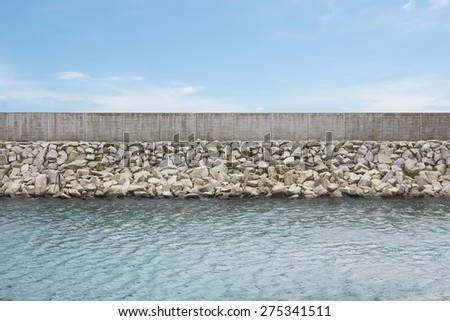 breakwater and wall with blue sky Stock fotó © 