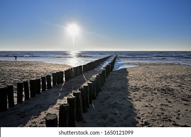 Breakwaters on a sunny winter beach in Vlissingen Holland