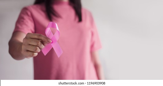Breast Cancer Awareness Concept.  Health care and medical. Hand of woman holding pink ribbon awareness symbol for endometriosis, Medicine. Prevention Breast. - Shutterstock ID 1196903908