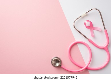 Breast cancer awareness concept. Top view photo of pink silk ribbon and stethoscope on bicolor pastel pink and white background with copyspace - Powered by Shutterstock