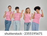 breast cancer awareness, excited interracial women with pink ribbons on grey, diversity, cancer free