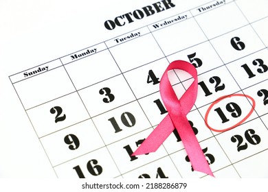 Breast Cancer awareness month and pink awareness ribbon. World day marked in red circle. - Shutterstock ID 2188286879