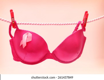 Breast Cancer Awareness Ribbon on Bra pegged to line