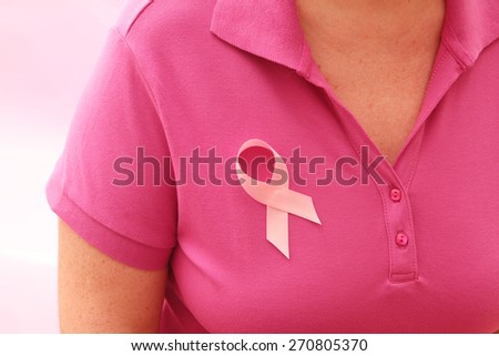Breast Cancer Awareness Ribbon pinned to shirt