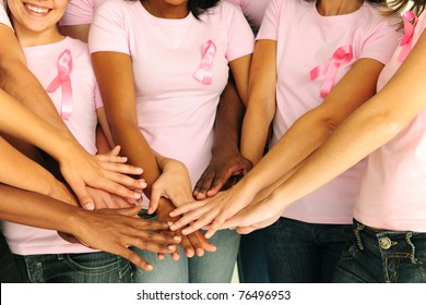 breast cancer awareness women joining hands for support - Powered by Shutterstock