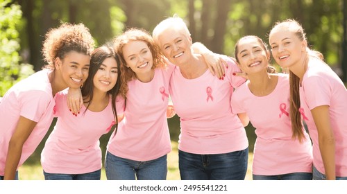 Breast Cancer Concept. Mutiracial Ladies In Pink T-Shirts With Ribbons Symbol Hugging Standing Outdoor - Powered by Shutterstock