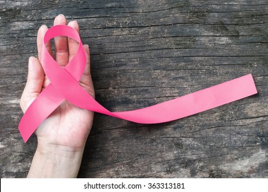Breast cancer pink awareness ribbon symbolic bow color raising support campaign on people living life with female tumor breast cancer - Shutterstock ID 363313181