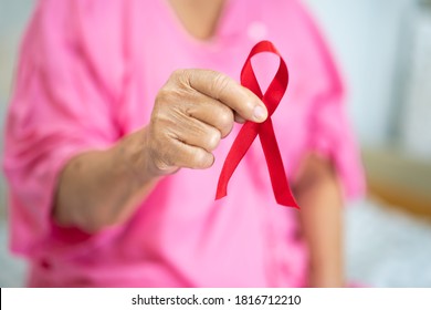 Breast cancer, pink ribbon at Asian senior lady patient for supporting awareness. - Shutterstock ID 1816712210