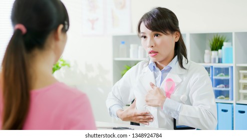 Breast Cancer Prevention Concept - Female Doctor Teach The Patient How To Self Check Breast