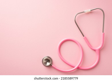 Breast cancer prevention concept. Top view photo of pink stethoscope on isolated pastel pink background with empty space - Shutterstock ID 2185589779
