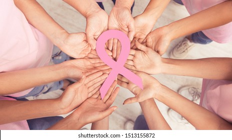 Breast Cancer Support. Female Hands Circle Holding Big Pink Ribbon Standing Together Indoor. Panorama, Top View - Shutterstock ID 1513155872