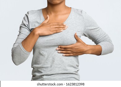 Breast Cancer. Young African Woman Feeling Breast Pain, Touching Her Chest, Cropped