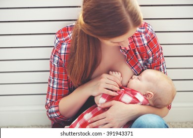 breastfeeding. mother breast feeding her baby toddler