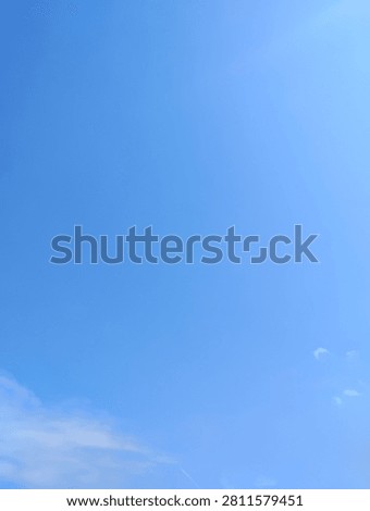 A breath taking view of a blue sky with less clouds. The scene is incredibly calm, open, and serene—perfect weather for being outdoors!