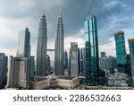 Breath taking view of Petronas twin Towers and Kuala Lumpur skyscrapers view with clouds.