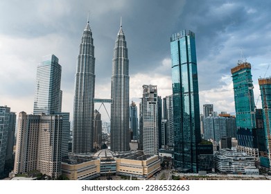 Breath taking view of Petronas twin Towers and Kuala Lumpur skyscrapers view with clouds. - Powered by Shutterstock