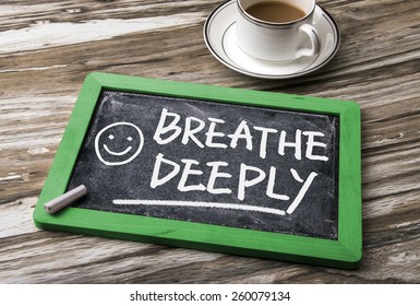 Breathe Deeply Handwritten On Blackboard