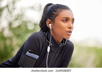 Breathe through what you go through. Shot of a fit young woman catching her breathe while completing her jog outdoors. - Shutterstock ID 2169038307