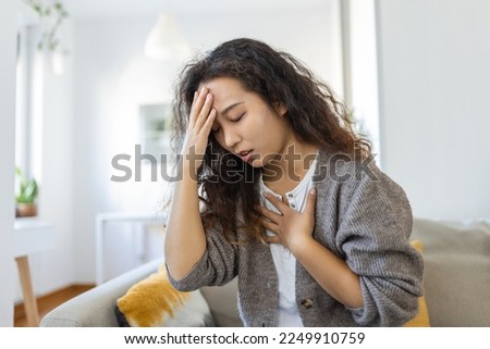 Breathing, respiratory problem, asthma attack, pressure, chest pain, sun stroke, dizziness concept. portrait of woman received heatstroke in hot summer weather, touching her forehead