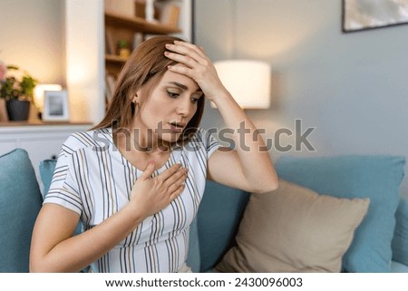 Breathing, respiratory problem, asthma attack, pressure, chest pain, sun stroke, dizziness concept. portrait of woman received heatstroke in hot summer weather, touching her forehead