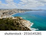 Breathtaking Aerial View Calpe Spain Mediterranean Coastline Penon de Ifach Rock Lush Vegetation Sunny Day Tourism Paradise, Panoramic Vista Calpe Costa Blanca Turquoise Waters Golden Beaches Iconic