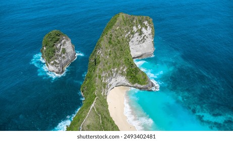 Breathtaking aerial view of dramatic coastal cliffs with lush greenery and pristine turquoise waters at Kelingking Beach. Perfect for travel, nature, and adventure projects. - Powered by Shutterstock