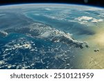 A breathtaking aerial view of Earth, showcasing the vastness of the ocean, fluffy cumulus clouds, and the horizon meeting the sky. A perfect example of na. Elements of this image furnished by NASA