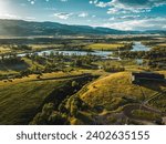 A breathtaking aerial view of Paradise Valley and Yellowstone River under a bright cloudy sky