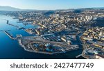 Breathtaking aerial view of Rijeka, Croatia, as a ship is being unloaded in the bustling port 