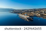 Breathtaking aerial view of Rijeka, Croatia, as a ship is being unloaded in the bustling port 