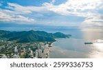 Breathtaking Aerial View of Santa Marta, Magdalena, Colombia with Lush Mountains and serene Coastline