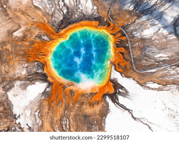 A breathtaking aerial view of the vibrant Grand Prismatic Spring, showcasing its vivid colors and striking patterns in Yellowstone National Park. - Powered by Shutterstock