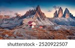 Breathtaking autumn scenery. Superb sunrise in Tre Cime Di Lavaredo National park with Paternkofel Peak. Spectacular morning scene of Dolomite Alps, Italy, Europe. Traveling concept background.