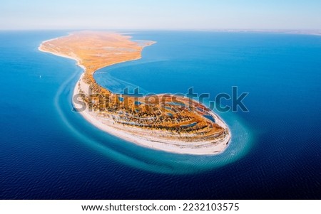 Breathtaking bird`s eye view of a curvy seacoast. Location place National park Dzharylhach, Black Sea, Ukraine, Europe. Aerial photography, drone shot. Photo wallpaper. Discover the beauty of earth.