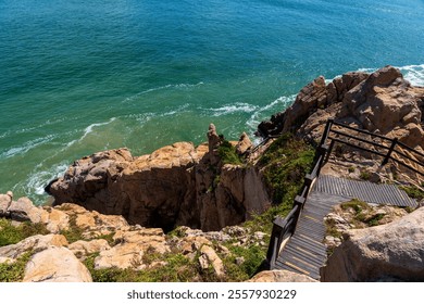 Breathtaking Coastal Cliff Overlook with Turquoise Waters and Rocky Shores   - Powered by Shutterstock