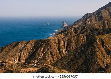 A breathtaking coastal landscape featuring rugged cliffs, ocean waves, and a serene blue horizon under a clear sky
 - Powered by Shutterstock