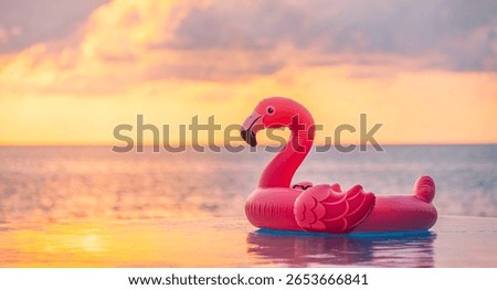 Breathtaking dreamy sunset infinity pool closeup with floating pink flamingo golden orange sky peaceful summer background luxury vacation scenic design tranquil tropical landscape travel inspiration