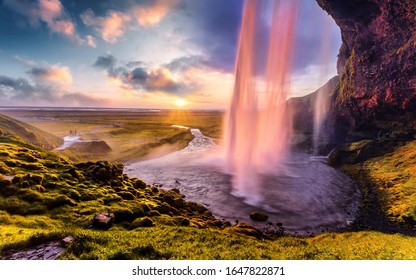 Breathtaking Evening View Of The Most Beautiful Waterfall Seljalandsfoss At Sunset. Wonderful Picturesque Scene. Amazing Icelandic Scenery. Iceland The Country Of Best Incredible Nature Locations.