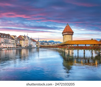 Breathtaking historic city center of Lucerne with famous buildings and old wooden Chapel Bridge (Kapellbrucke). Popular travel destination .  Location: Lucerne, Canton of Lucerne, Switzerland, Europe - Powered by Shutterstock