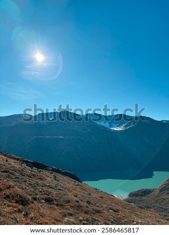 Similar – Image, Stock Photo Sunlit peak of a massive rock formation with the Caminito del Rey path along the side in Malaga