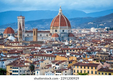 Breathtaking panorama of Florence (Firenze) at golden sunset from Piazzale Michelangelo. The Duomo, Palazzo Vecchio and other Renaissance landmarks bask in warm evening light